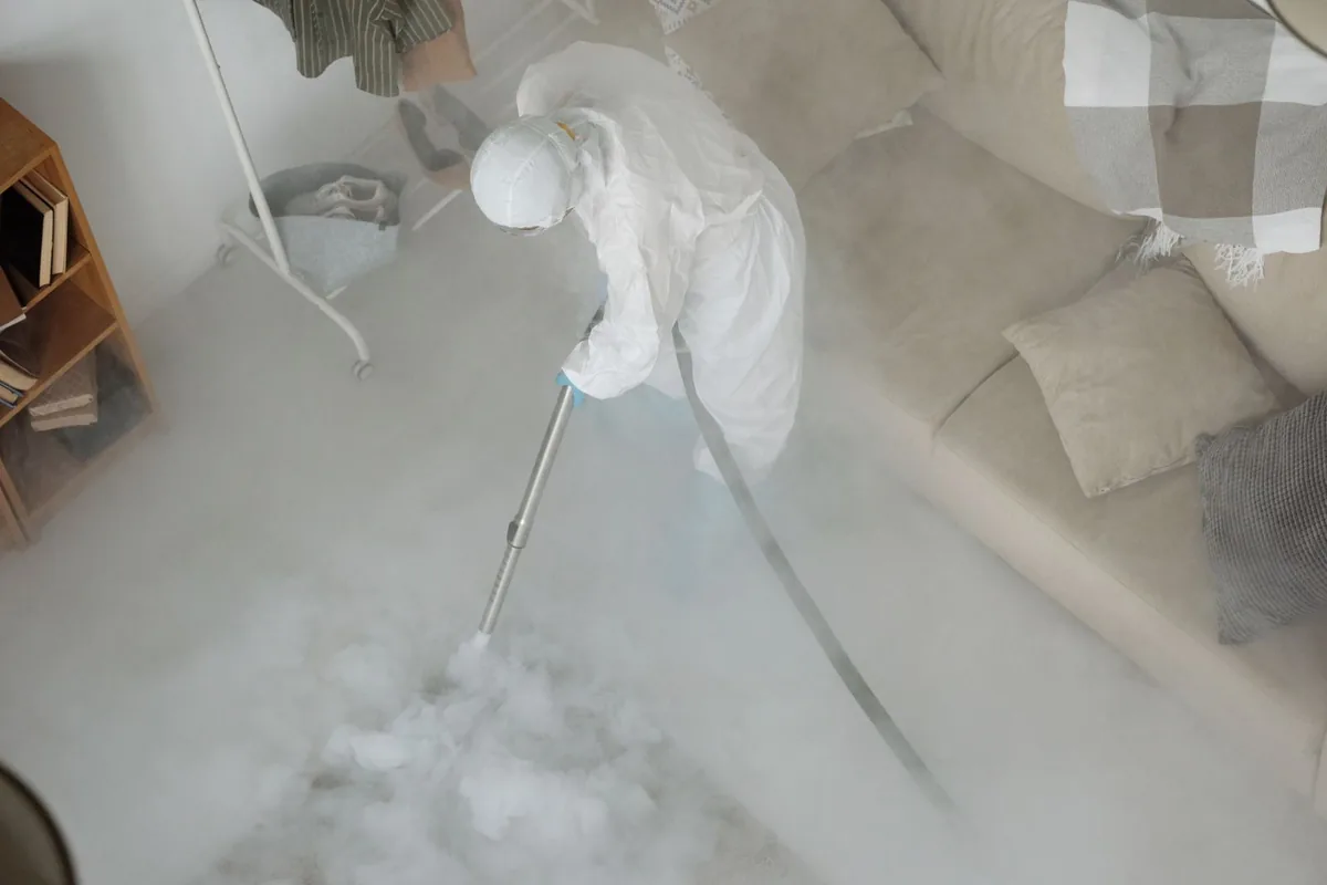 Biohazard cleanup technician in protective equipment, Fox Lake, WI